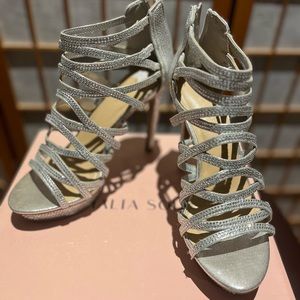 Silver metallic open toe shoe sandal.